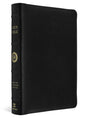 A black textured leather Holy Bible with gold lettering on the spine, shown at a three-quarter angle against a white background.