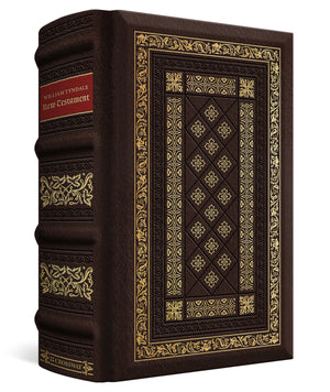 A classic hardcover book with a dark brown leather-like cover, ornate gold foil detailing, and a red title block on the spine, shown on a clean white background.