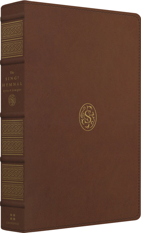 Brown leather-bound hymnal with gold embossed detailing on the spine and front cover, including a circular monogram logo.