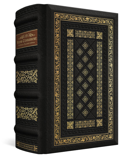 A black leather-bound book with ornate gold foil detailing on the cover and spine, featuring a brown label on the upper spine