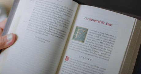 William Tyndale New Testament, 500th Anniversary Edition (Leather over Board) open to the Gospel of Luke, held in hand