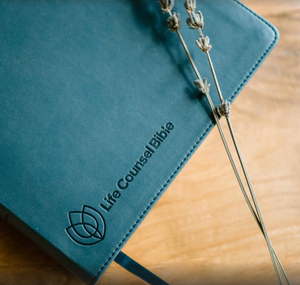 Close-up of the debossed cover of CSB Life Counsel Bible, Slate Blue Leathertouch: Practical Wisdom for All of Life