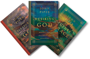 Three John Piper books fanned out against a black background: The Pleasure of God, Desiring God, and Future Race. The covers feature richly colored cosmic and landscape-style artwork with gold typography and decorative borders.