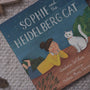 sophie and the heidelberg cat on floor